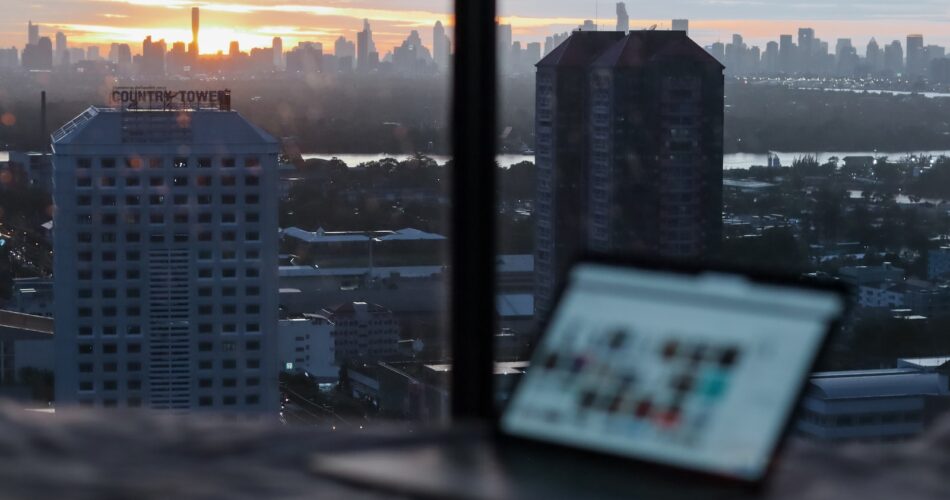 white and black high rise buildings during sunset
