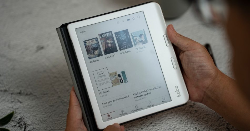 A person holding a tablet with a page on it